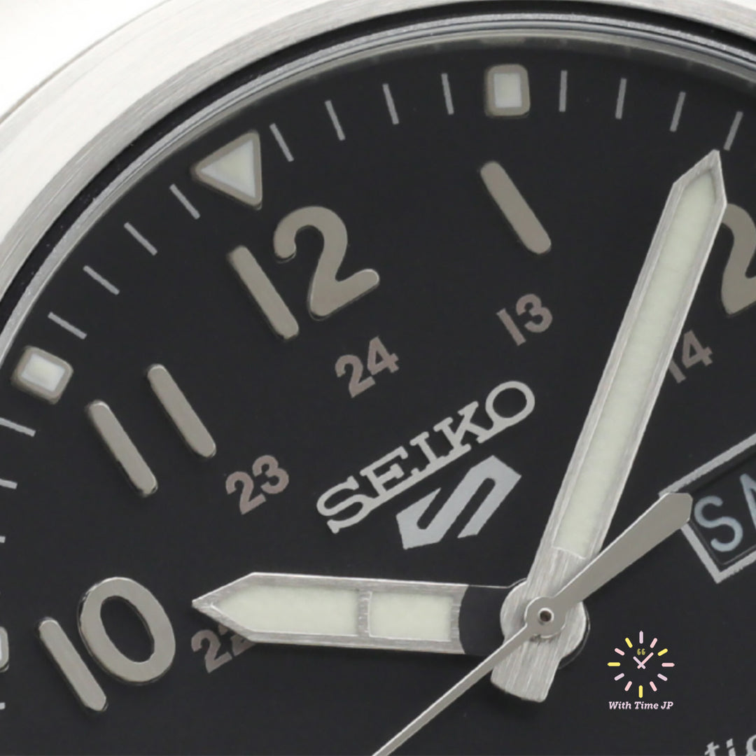 Close-up of the black dial of the SEIKO 5 SPORTS SBSA111 automatic wristwatch.