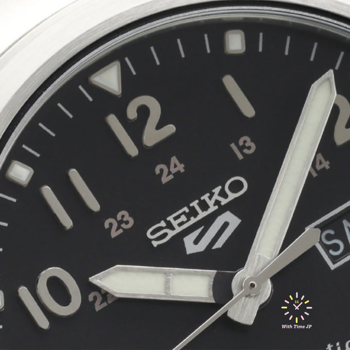 Close-up of the black dial of the SEIKO 5 SPORTS SBSA111 automatic wristwatch.