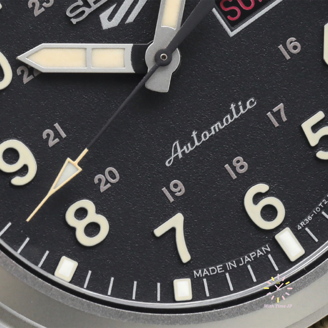 Close-up of the black dial of the SEIKO 5 SPORTS SBSA117 automatic wristwatch.
