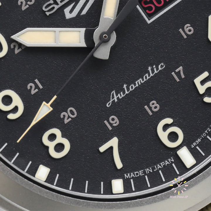 Close-up of the black dial of the SEIKO 5 SPORTS SBSA117 automatic wristwatch.