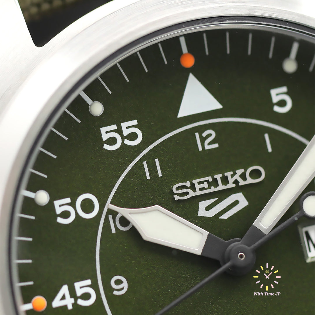 SEIKO 5 SPORTS SBSA141 Close-up of the green dial 12 o'clock side of the automatic watch.