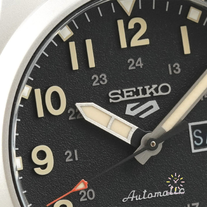 SEIKO 5 SPORTS SBSA201 Close-up of the black dial of the automatic watch.