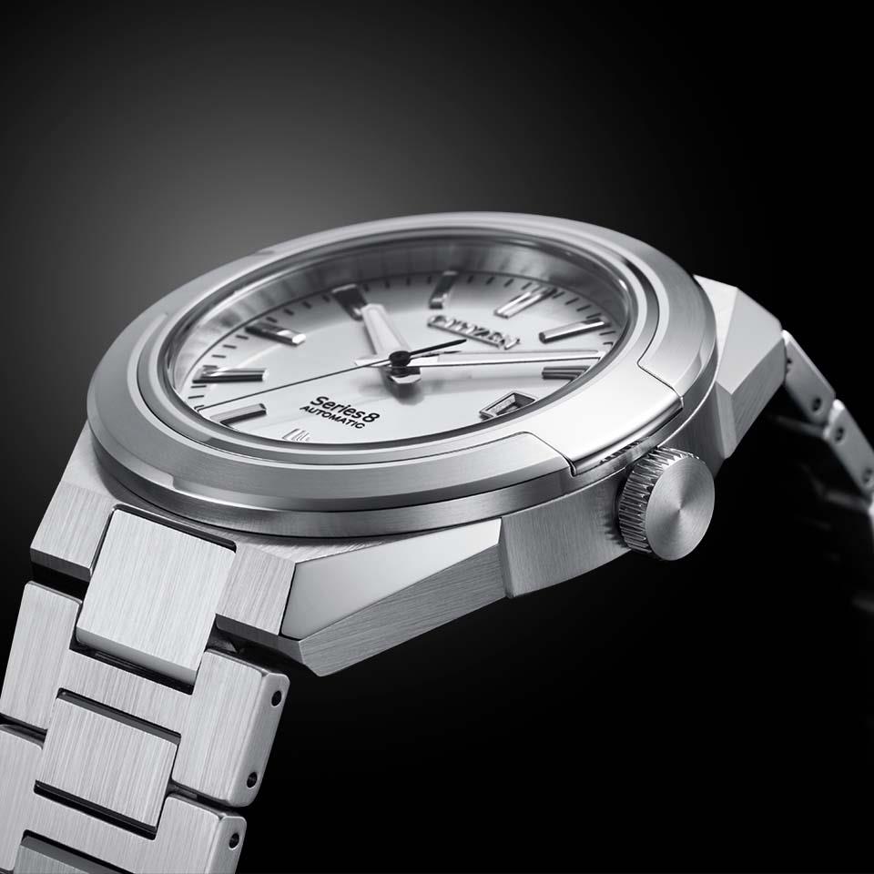 Citizen Series Eight NA1000-88A Mechanical Men's Watch, Stainless Steel Case, White Dial, Stainless Triple Link Band,Rug angle.