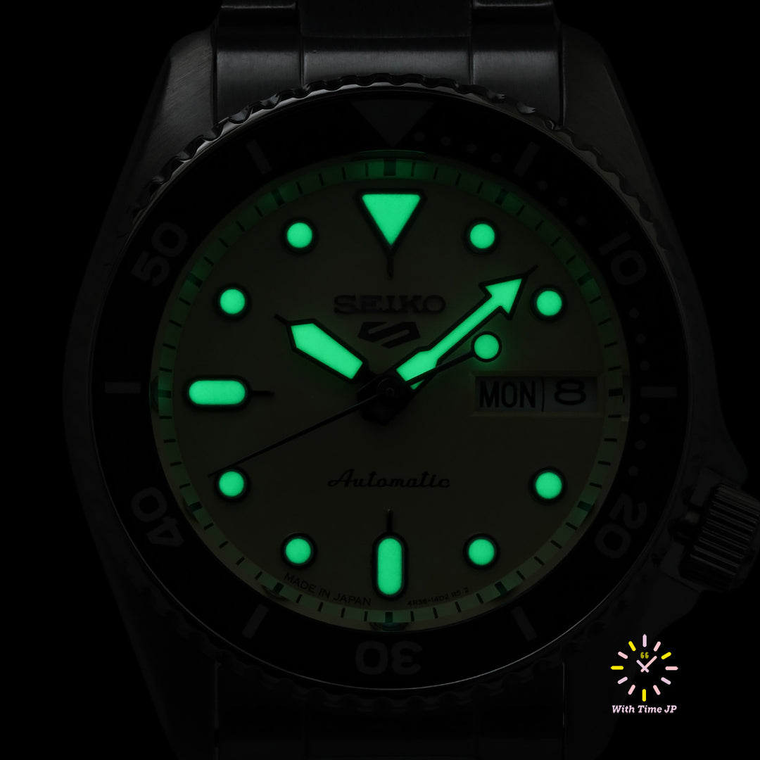 LumiBrite hands and markers glowing on the Seiko 5 Sports SBSA227.